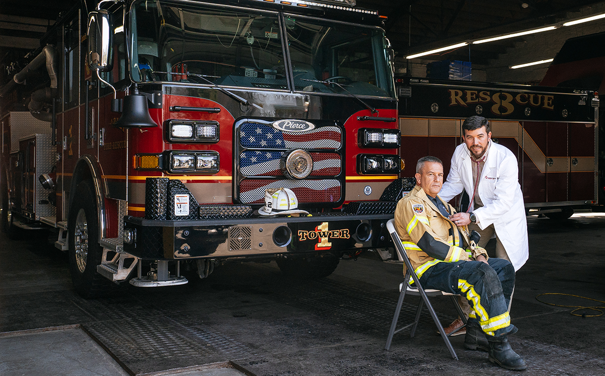 medical provider treating a fire fighter patient medical provider treating a fire fighter patient